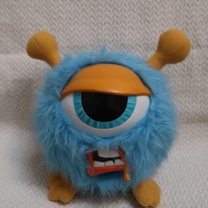 Big Eyeball. Funny ugly monster. Turquoise. Rare Talking Plush Soft Toy. 19 cm high. Sounds + vibration. Interactive. Adopt at your own risk