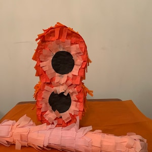 Beautiful handmade number 8 birthday  piñata to brighten up any party.