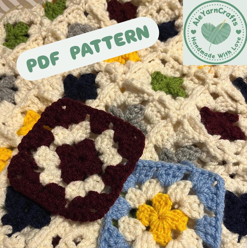 May include: A close-up of a crocheted blanket with a granny square pattern. The blanket is cream-colored with squares in various colors, including burgundy, blue, yellow, green, and gray. The text "PDF PATTERN" is overlaid on the image.