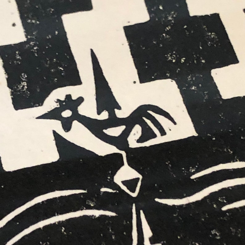 May include: Black and white linocut print of a rooster with a star on its head, standing on a platform with a pointed top. The rooster is facing the right side of the image. The background is a black and white checkered pattern.