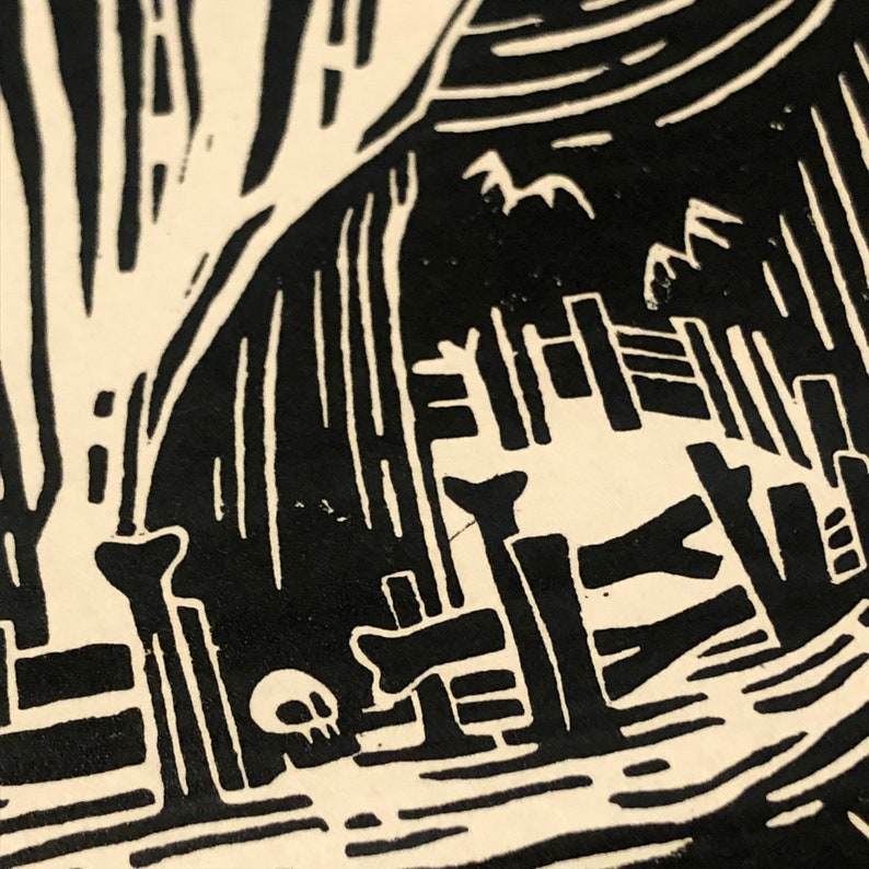 May include: Black and white woodcut print of a house with a fence and a skull in the foreground. The house is made of wood and has a thatched roof. The fence is made of vertical planks. The skull is small and sits on the ground.