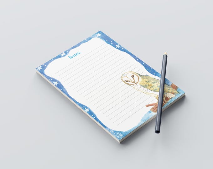 Elongated notepad with a barn owl in a wintry setting