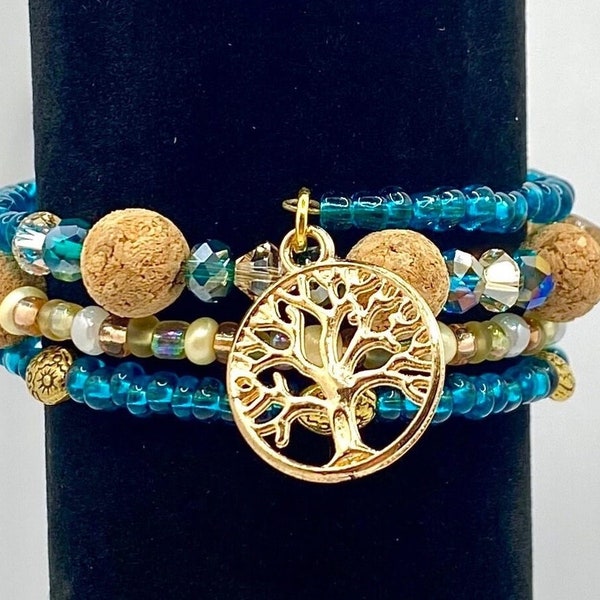 Teal and  cream memory wire wrap bracelet with cork beads, tree of life/feather charms. Boho beaded cuff. Seed bead wrap. Multicolor cuff