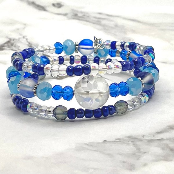 Memory wire bracelet with frosted snowflake bead, blue mermaid glass. Sky/royal blue stacked cuff. Seed bead angel charm/handmade charm wrap