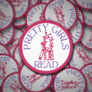 May include: A close-up of several pink and white fabric patches with the text "Pretty Girls Read" and a stylised image of a stack of books and a sprig of flowers.
