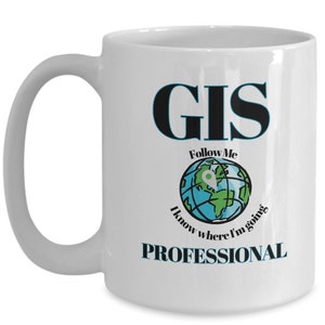 May include: White ceramic coffee mug with a black and blue graphic that says "GIS Follow Me I know where I'm going PROFESSIONAL".