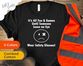 É tudo diversão e jogos até que alguém perca um olho | Camiseta do gerente de segurança | Use seu EPI | Camiseta de óculos de segurança | Atire no seu olho