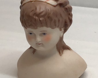 4.5 inch China doll head, signed by artist,  Mark Farmer