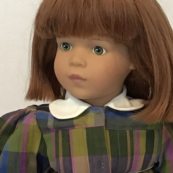 Very sweet 22" Sigikid Puppen doll with a cloth body, vinyl face, hands/arms and legs/feet.