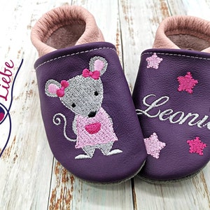 a pair of purple shoes with a mouse on them