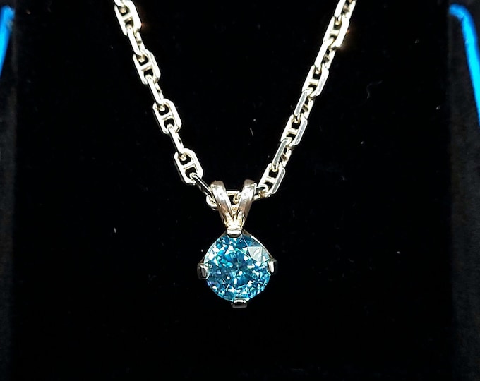 Genuine blue Zircon (Not Cubic Zirconia) set in sterling silver. Pendant only, chain options available in variation