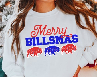 May include: White sweatshirt with the text "Merry Billsmas" in red and blue. Three blue and red buffalo silhouettes are below the text.