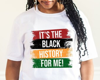 May include: A white t-shirt with the text "It's the Black History for Me!" printed on it in black, red, yellow, and green. The text is surrounded by a red, black, yellow, and green paint-splattered design.