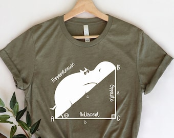 May include: A green t-shirt with a white graphic of a hippopotamus lying on its side, forming the hypotenuse of a right triangle. The words "Hypotenuse", "Opposite", and "Adjacent" are labeled on the triangle.