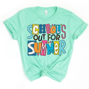May include: A turquoise t-shirt with the text "School's Out For Summer" in colorful, block letters.