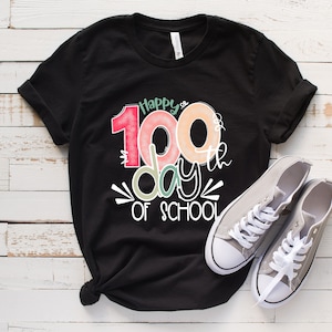 May include: Black t-shirt with a colorful graphic that says "Happy 100th day of school".
