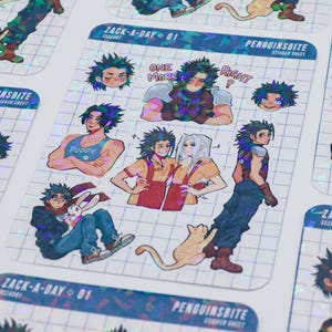 May include: Sticker sheets featuring anime-style illustrations of a character with spiky black hair. The stickers have a holographic finish and include the text "ZACK-A-DAY 01" and "PENGUINSBITE". The character is depicted in various poses.