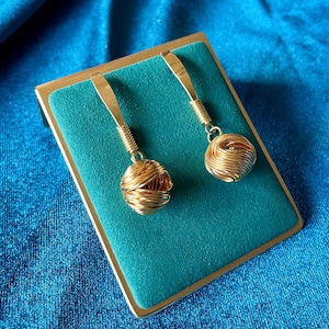 Vintage Abstract Gold Tone Dangle Earrings with Elongated Hook and Wrapped Wire Ball