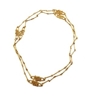 Vintage goudkleurige extra lange ketting met gestileerde open geometrische schakels