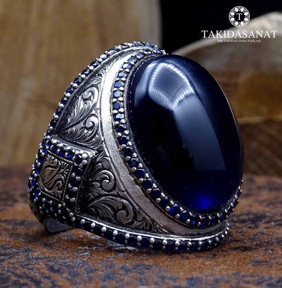 Silver ring with cheap dark blue stone