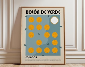 May include: A framed wall art print titled BOLÓN DE VERDE ECUADOR. The poster features a beige background with a blue central panel containing eleven textured orange circular illustrations and one white circle. Small dark leaves are scattered around.