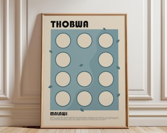 May include: A framed poster with a beige background featuring the text THOBWA at the top and MALAWI at the bottom. A blue rectangular graphic contains eleven light beige circles arranged in a grid, with small blue leaf icons scattered around.