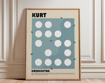 May include: A framed wall art print featuring the text KURT and KAZAKHSTAN in black, with a central blue rectangle containing twelve white speckled circles arranged in a grid pattern, accented by small scattered blue leaf shapes on a beige background.