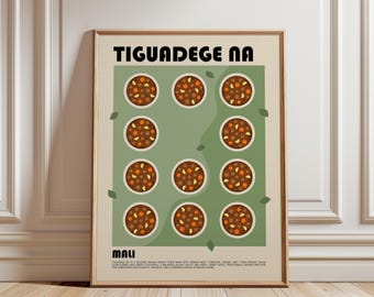 May include: A framed wall art print featuring the text TIGUADEGE NA and MALI. The design displays eleven circular illustrations of a brown stew with orange chunks arranged on a sage green background, set against a cream-colored border.