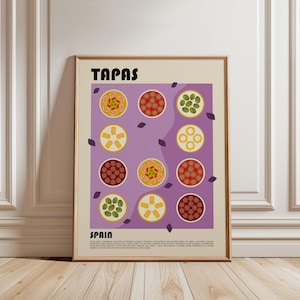 以下が含まれることがあります： 上部に黒字で「TAPAS」と書かれた額入りのポスター。ポスターは、小さなボウルに入ったさまざまなタパス料理のイラストが描かれた紫色の背景が特徴です。「SPAIN」という言葉が一番下にあります。