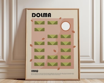 May include: A framed wall art print featuring the text DOLMA and IRAQ with a graphic illustration of green stuffed grape leaves arranged in rows on a muted pink background, accented by small brown leaf shapes and a white circle in the upper right.