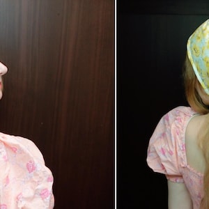 May include: A yellow floral headscarf with a light blue background. The headscarf is worn over long blonde hair. The person is wearing a pink dress with a floral pattern.