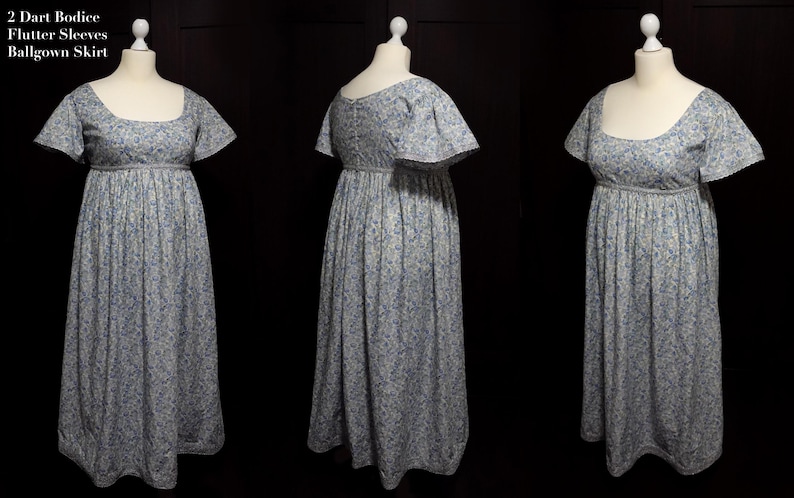 Op de afbeelding: Een witte jurk met een blauw bloemenpatroon. De jurk heeft een getailleerd lijfje met een vierkante halslijn en een volle rok. De mouwen zijn kort en zwierig.