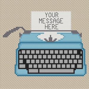 May include: A blue vintage typewriter with a white paper insert that says "YOUR MESSAGE HERE". The typewriter is on a beige background.