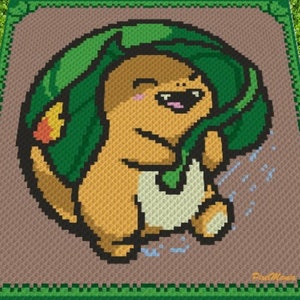 May include: A crochet pattern of a brown and orange Pokemon character with a green leaf on its head. The character is smiling and has a white patch on its chest. The background is brown with a green border.