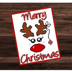 May include: A Christmas card with a reindeer design. The card features the words "Merry Christmas" in red, along with a reindeer face made of pixelated elements. The reindeer has brown antlers, white eyes, and a red nose.