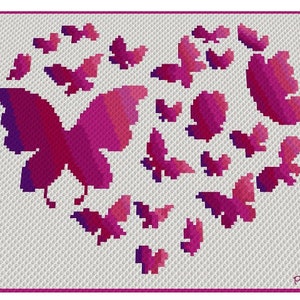 May include: A crochet pattern featuring a heart shape made of pink butterflies. The pattern is on a white background.