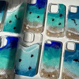 Ocean wave design custom iPhone and Samsung phone cases. Sharks, sea turtles and manta rays. Clear phone cases with blue beach waves.
