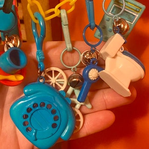 1980's Clip Charms With Bells, Snow Skis, Baby Bottle