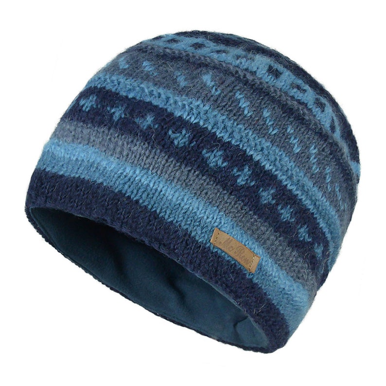 May include: Blue and gray knitted beanie with a fleece lining. The beanie has a brown leather tag with the word "Woolrich" on it.