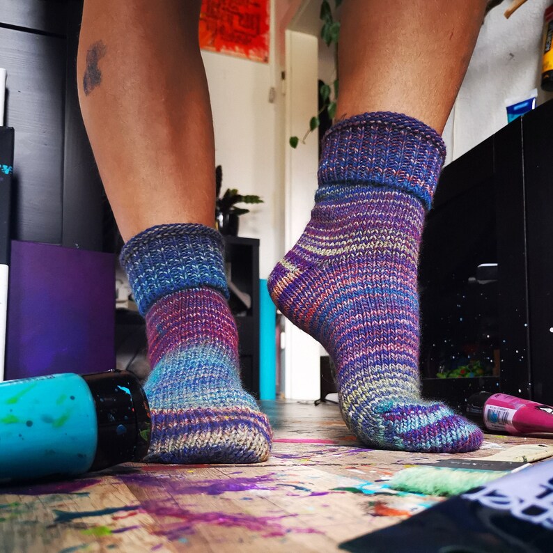 Colorful knitted socks in flowing colors 