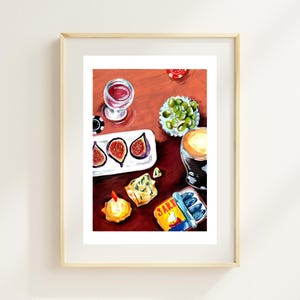 May include: An overhead view of a framed art print featuring a still life of food and drinks. The painting includes a glass of red wine, olives, figs, cheese, sardines, and a dark beverage. Poker chips are scattered on the reddish-brown surface.