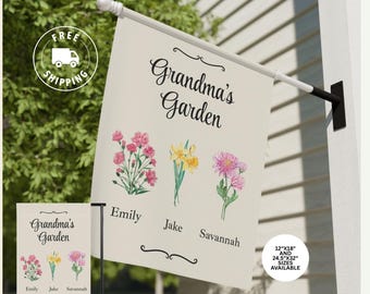 May include: A cream-colored garden flag with the text "Grandma's Garden" and floral illustrations. The flag includes the names "Emily", "Jake", and "Savannah" below the flowers. Available in 12"x18" and 24.5"x32" sizes.