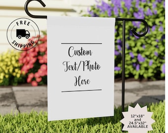 May include: White garden flag with black text that reads "Custom Text/Photo Here". The flag is attached to a black metal pole. The flag is available in two sizes: 12"x18" and 24.5"x32".