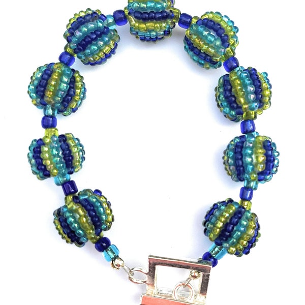 Handmade Beaded Bracelet with Blue, Green, and Yellow Beaded Beads with Ebeads and a Silver Square Toggle Clasp