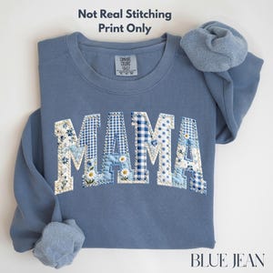 May include: A trio of ceramic mugs with a speckled, matte finish in cream, light grey, and dark grey. Each mug features a simple, minimalist design, ideal for tea or coffee.