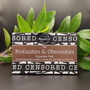 May include: A brown box with black text that reads "The Profanities & Obscenities Expansion Pack" and "240 adult themed poetry magnets to enhance your Little Magnet Co. Starter Pack". The box is surrounded by black and white text that reads "SORED CENSO ED CENSORED CE".