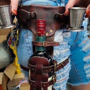 Adjustable Whiskey Bottle Holster with collapsible shot glasses
