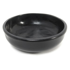 May include: A black, round, ceramic bowl with a smooth, glossy finish. The bowl is empty and has a slight curve to the sides.