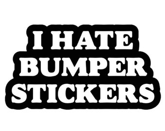May include: Black and white sticker with the text "I hate bumper stickers".