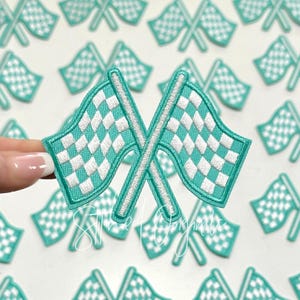 May include: A set of 12 teal blue and white checkered racing flag iron-on patches. The patches are approximately 2 inches wide and 3 inches long.